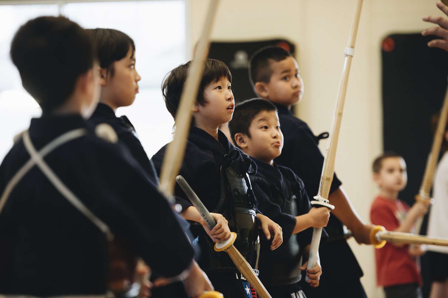 Chris Yang and his brother, Daniel, smiling and standing in Kendo gear